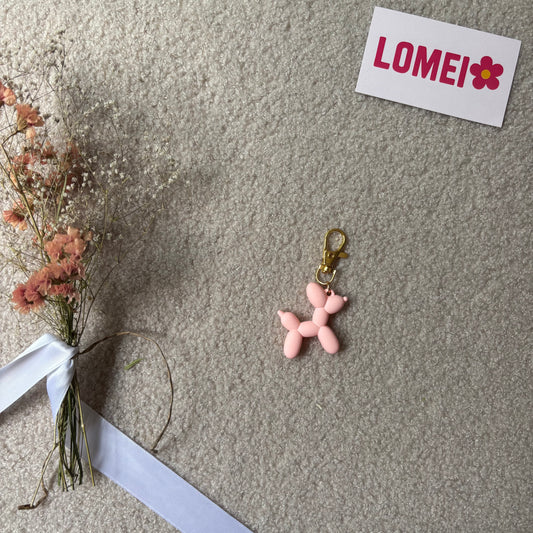 Chien effet ballon rose